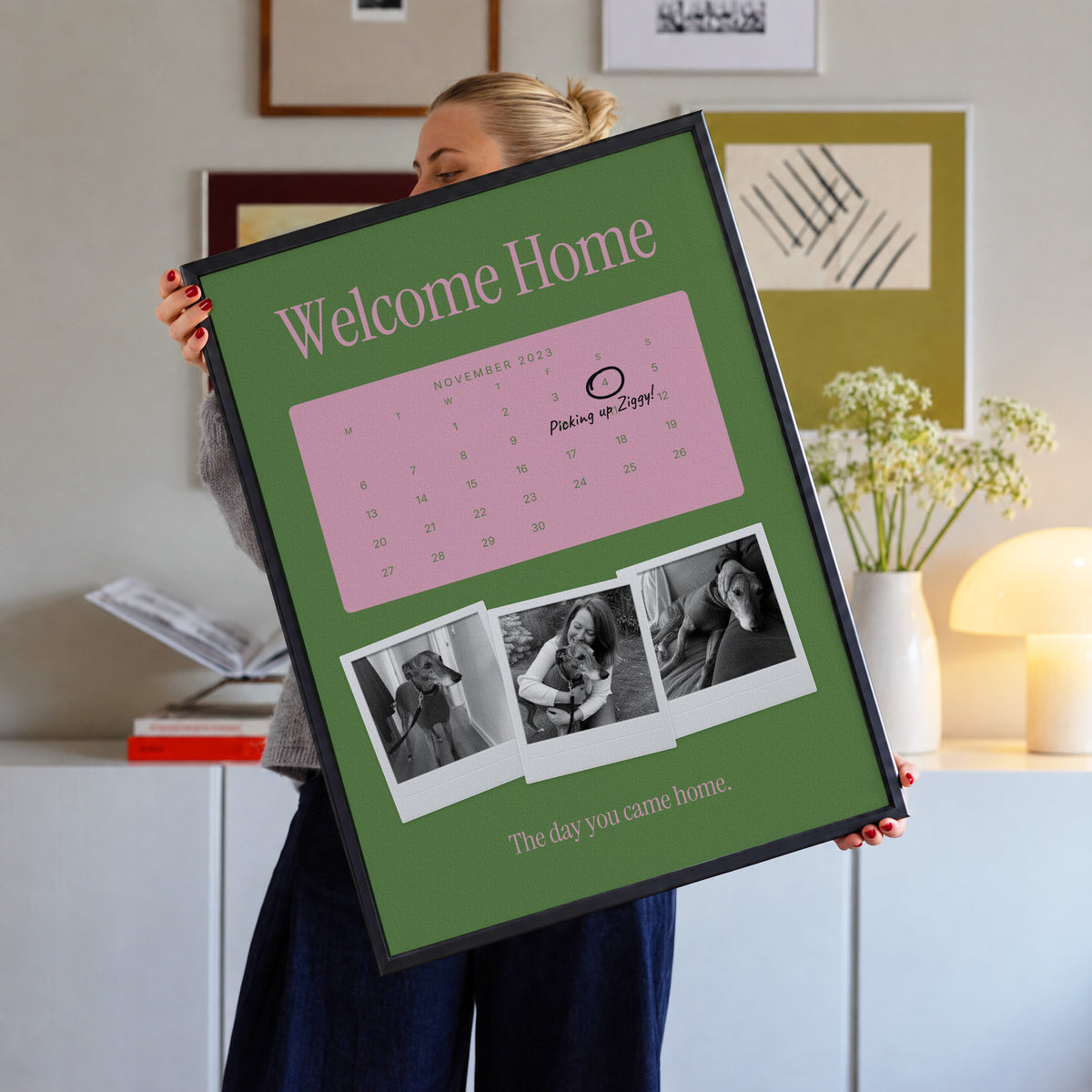 Anniversary calendar pet photo print, Lawn & Gum, black frame, held up in a living room
