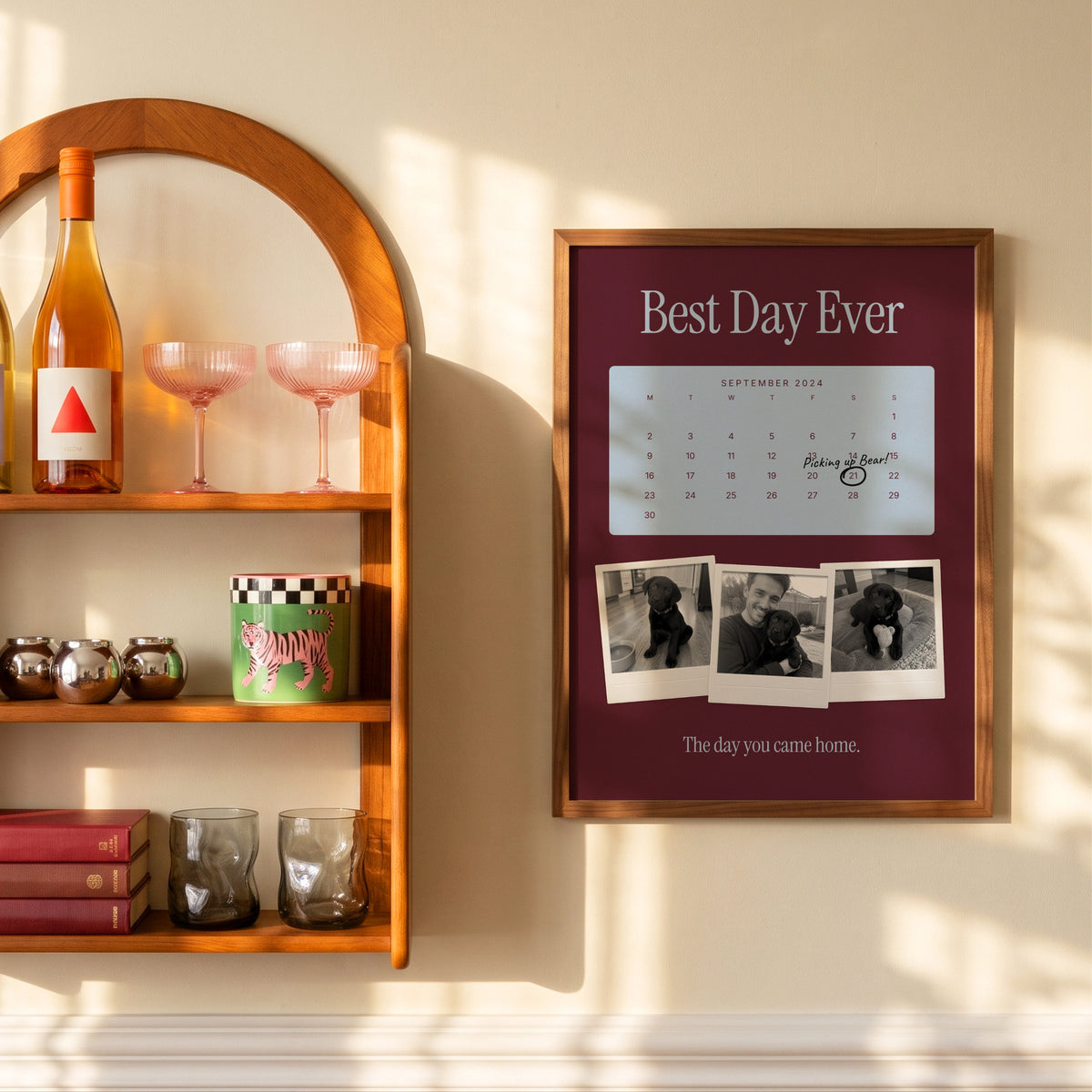 Anniversary calendar pet photo print, Milk Chocolate & Sky, wooden frame on a sunlit wall beside a shelf