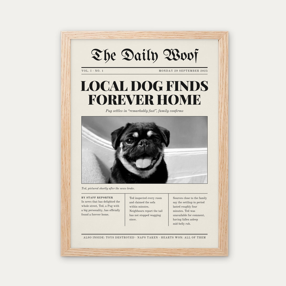 Gotcha Day custom pet newspaper print in a light birch wood frame, with an example photo