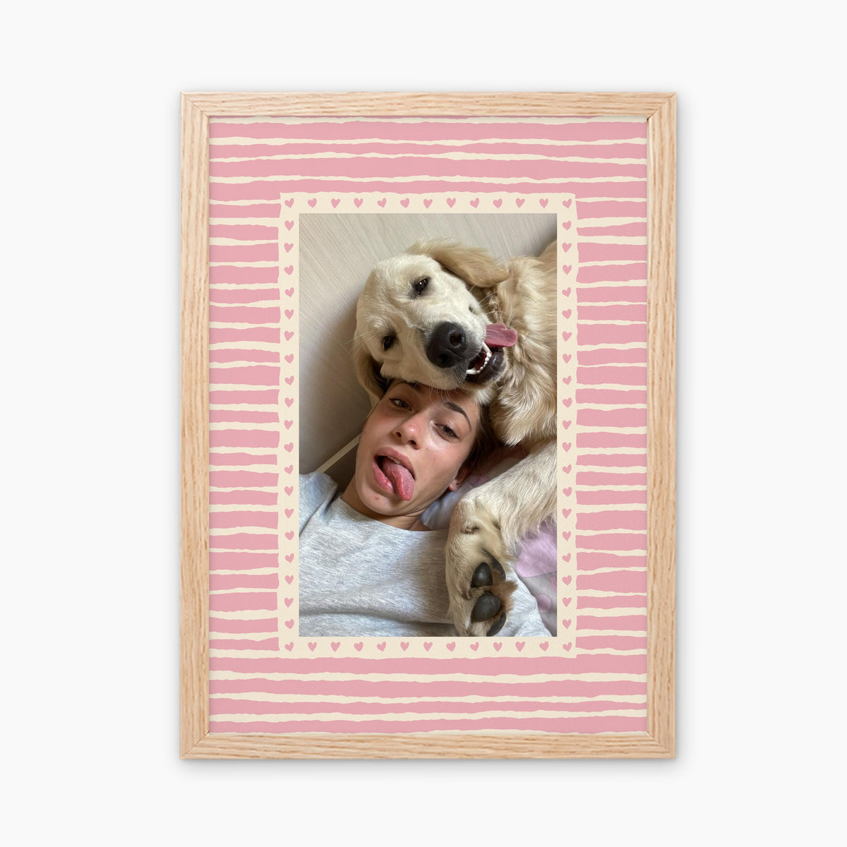 Hearts custom pet photo print in Blush Pink, in a light birch wood frame, with an example photo