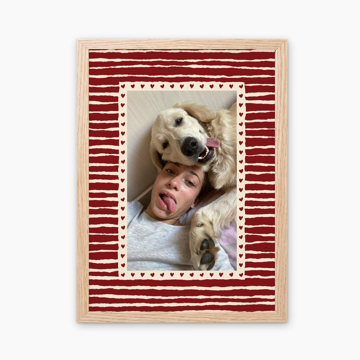 Hearts custom pet photo print in Cherry Red, in a light birch wood frame, with an example photo