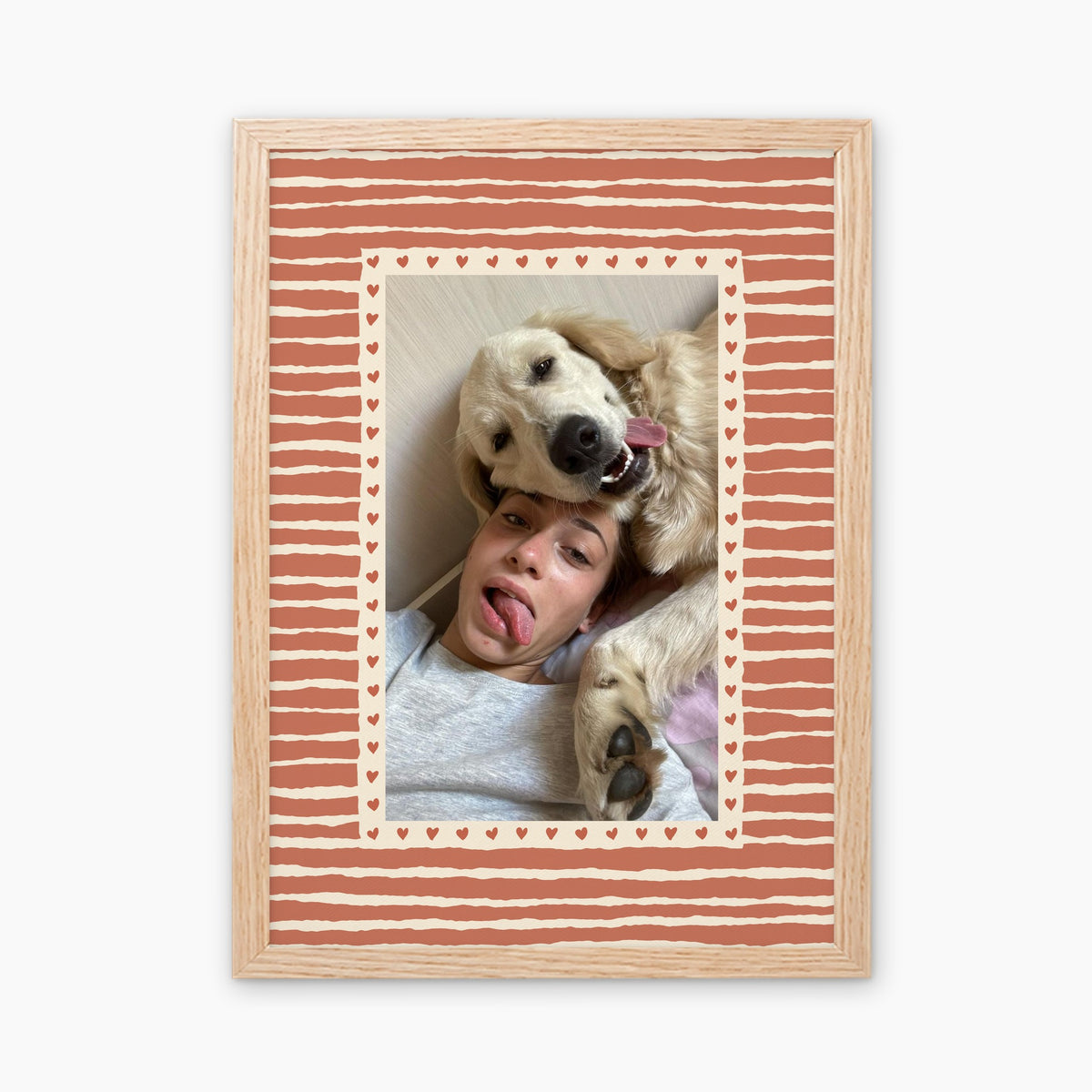 Hearts custom pet photo print in Terracotta, in a light birch wood frame, with an example photo